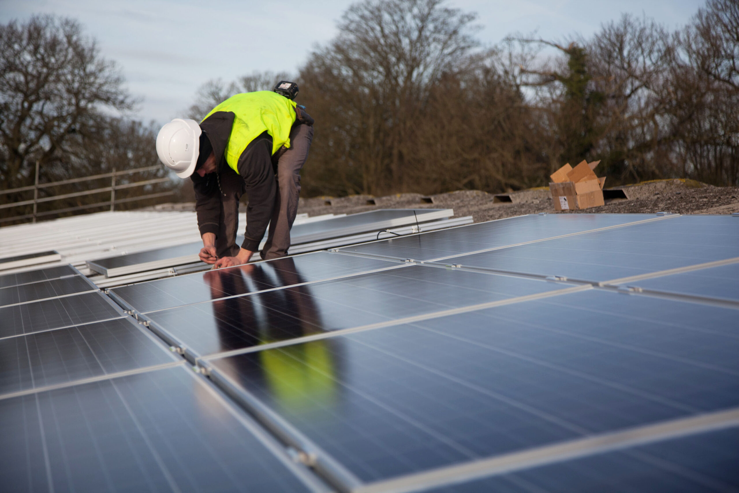Solar panel installer on a barn roofSolar panel installer on a barn roof. CC BY 2.0 Possible